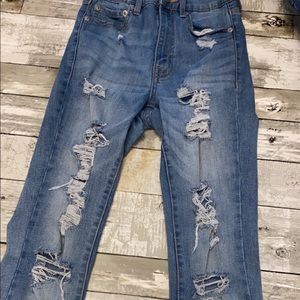 High rise ripped blue jeans from American eagle.